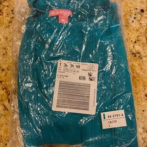 Women within teal light cardigan.